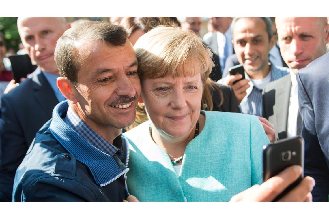 Merkel: Reform der Schuldenbremse für Investitionen wichtig Die Wirkung ihres Selfies mit einem syrischen Flüchtling überrascht Merkel.