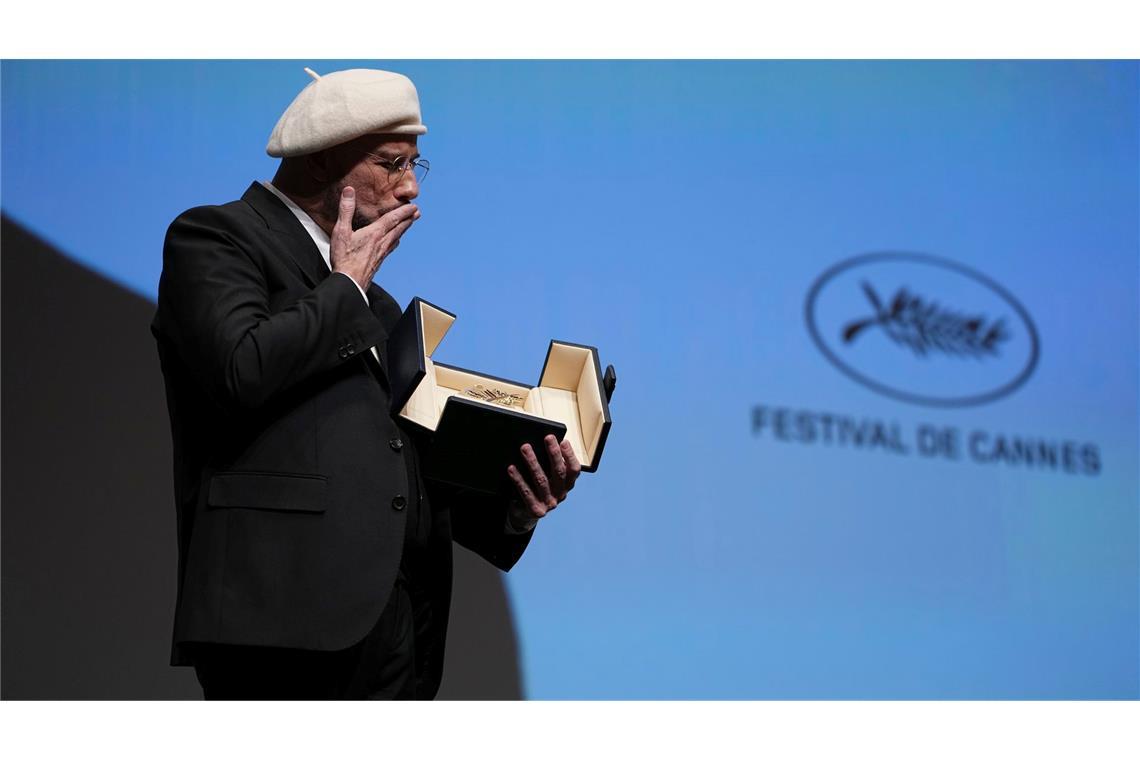 John Travolta wurde mit der Goldenen Ehren-Palme überrascht.